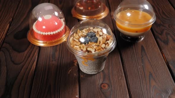 Closeup of Various Fruit Desserts with Chia Seeds Nuts and Berries on a Table