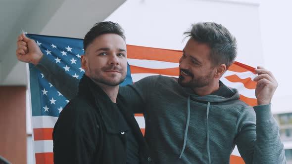 Happy Gay Male Couple Holding Usa Flag