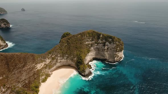 Rocky Cliff with Beach in the Sea. Karang Dawa