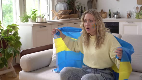 Woman Sports Fan at Home with the Flag of Sweden