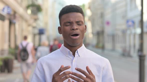 Portrait of African Man Reacting to Loss Outdoor