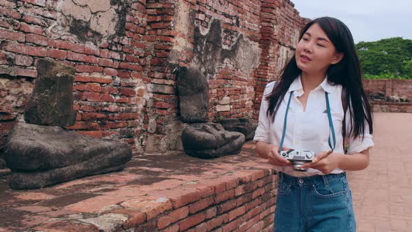 Japanese backpacker female enjoy her journey at amazing landmark in traditional city.