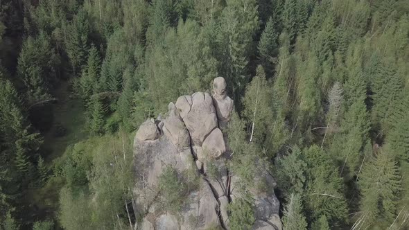 Stone rocks Ternoshorska Lada amidst beautiful scenic Carpathian forests, Ukraine