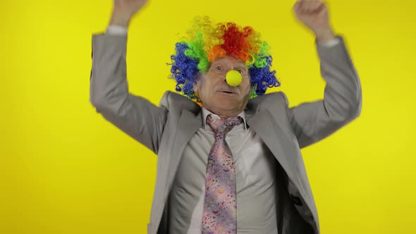 Elderly Clown Businessman Entrepreneur Dancing, Celebrate, Making Silly Faces