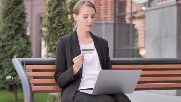 Online Shopping Failure for Young Businesswoman Sitting on Bench