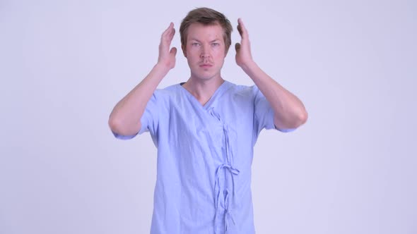 Young Man Patient Showing Hear No Evil Concept