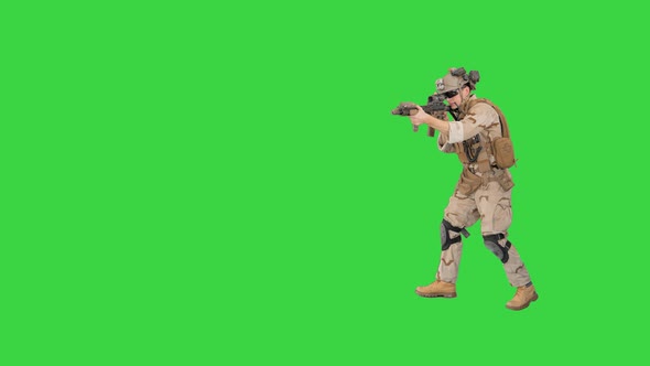 Armed Marine Soldier with Assault Rifle Walking By Aiming on a Green Screen, Chroma Key