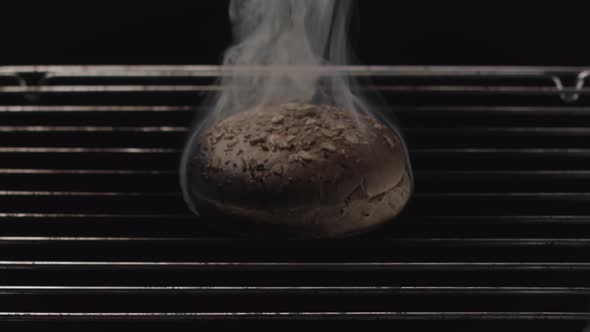 Overbaked burger bun and raising smoke