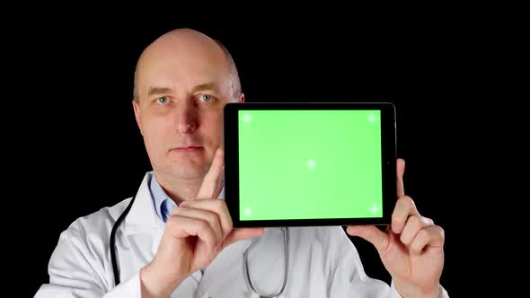 Front View of Doctor Holding Tablet with Green Screen