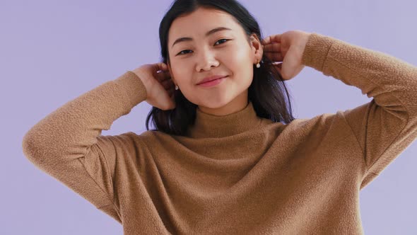 Asian Female in Brown Pullover