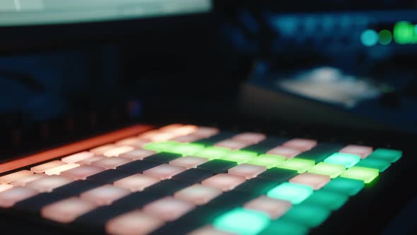 Closeup of Music Producer Working on Drum Controller