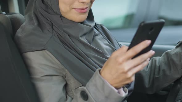 Muslim Female Driver Using Phone While Stuck in Traffic Jam, Risk of Accident