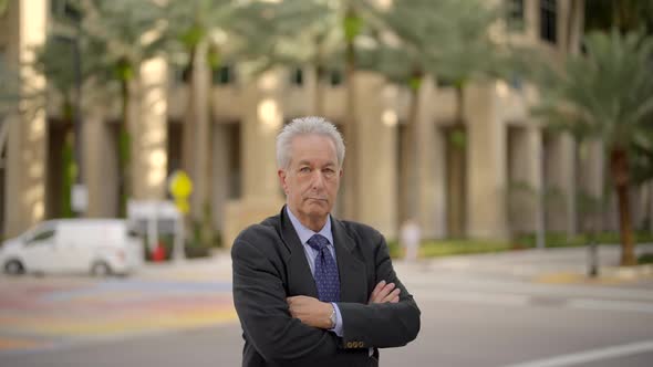 Motion Video Businessman With Arms Crossed In City Setting