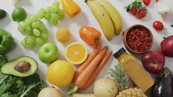 Video of fresh fruit and vegetables on white background