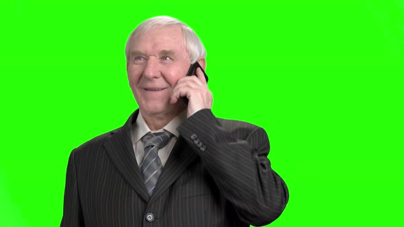 Senior Businessman Talking on Phone and Laughing.