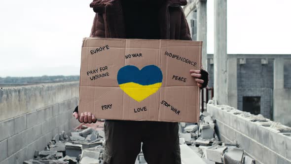 Ukrainian Boy Holding an Antiwar Placard in His Hand