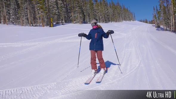 4K Female Adult Skier Feeling Happy and Excited While Skiing Down the Mountain