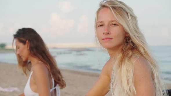 Beautiful Women Preparing Surfboards