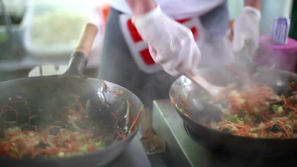 Chinese Chef Prepares Food at the Festival Street Food in Kiev