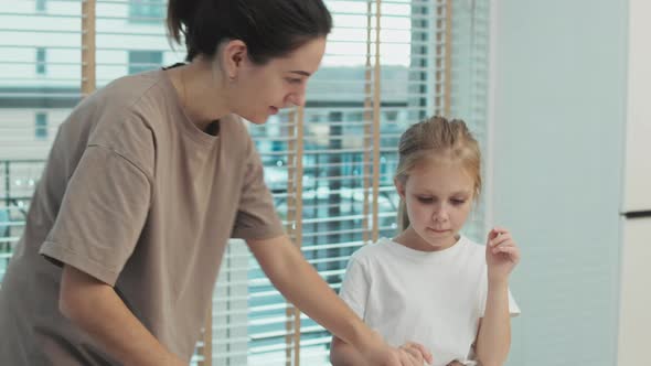 Mother And Daughter Baking Together