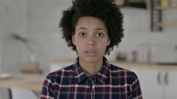 Portrait of African American Woman Saying No with Head Sign