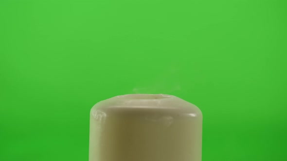 Burning Wax Candle on Green Chroma Key Background