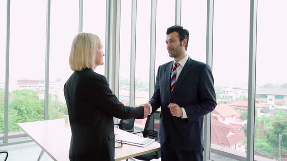 Business People Handshake with Friend at Office