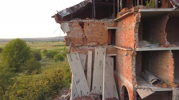 Aerial view of an old ruined building after earthquake. A collapsed brick house.
