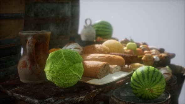 Food Table with Wine Barrels and Some Fruits Vegetables and Bread