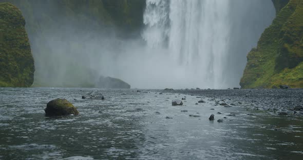 Beautiful Skogafoss Waterfall with River Reflection in Iceland