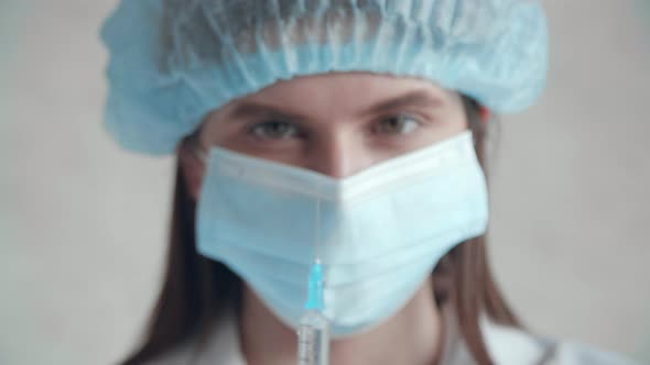 Closeup of a Healthcare Worker Preparing for the Injection