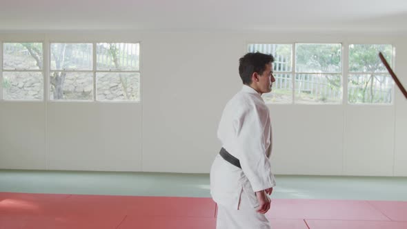 Judokas training with a wooden saber