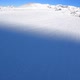 A Snowboarder Descends at Speed From a Mountainside in the Alps - VideoHive Item for Sale