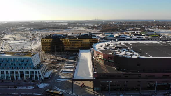 Drone flying over Hyllie towards Emporia, Malmö arena, Öresundsbron. Wintertime Malmö Sweden