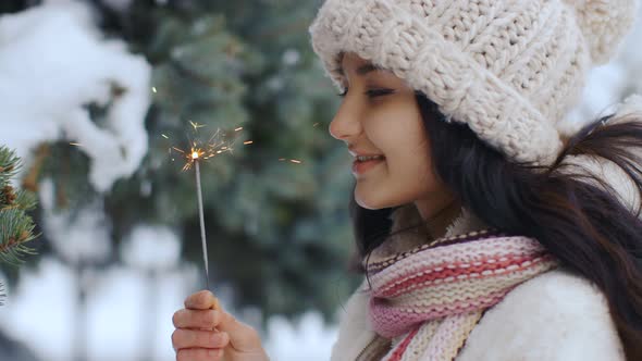 Winter Young Woman Portrait with Burning Firelight .