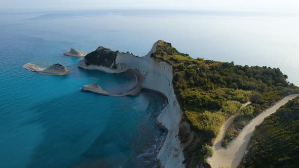 Drone Over Coastline Cliffs And Sea At Sunrise Of Cape Drastis