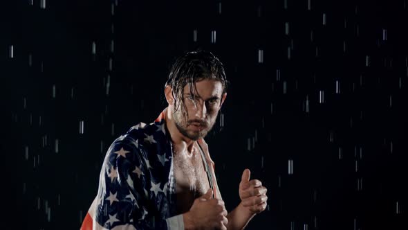 Victorious Man In The Rain With American Flag