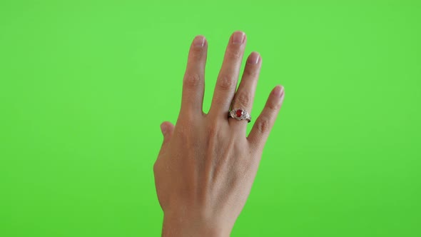 Silver ring with red stone on tower in front of green screen display 4K 2160p UltraHD footage - Gree