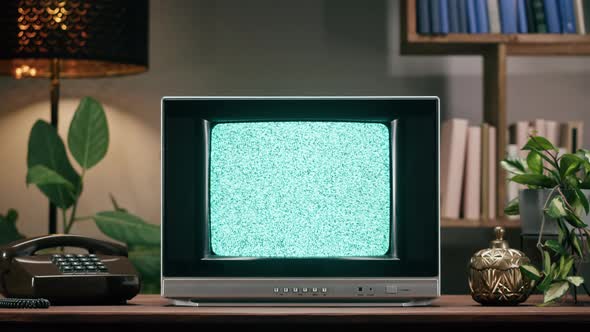 Old Television with Grey Interference Screen on Home Background