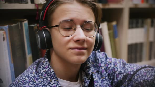 Young Guy Enjoying Music in Headphones, Close-up