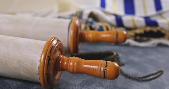 Jewish Holidays During Prayer Items with Shawl Tallit on Torah Scroll in a Synagogue