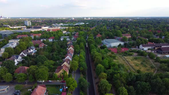 Railroad tracks with yellow moving subway trainPerfect aerial view flight panorama overview drone f