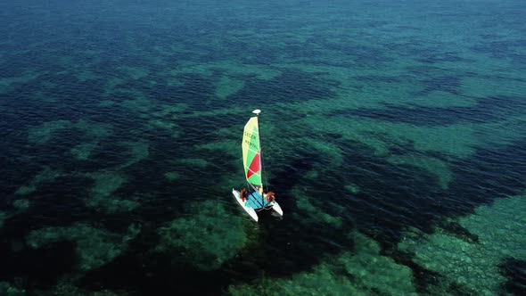 Yach in the Ocean Over Coral Reef