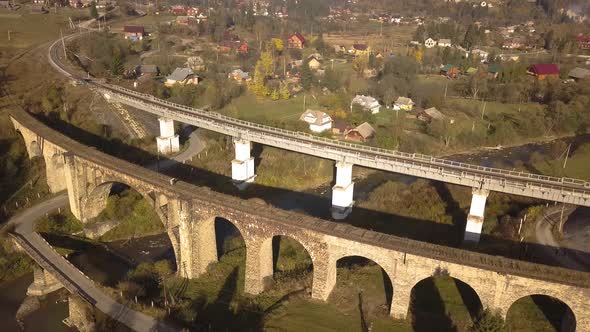 Aerial view of an old ruined train bridge in town of Vorokhta in Carpathian mountains, Ukraine.