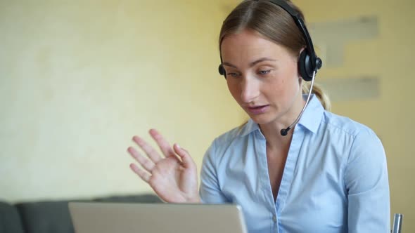 Woman Wear Headset Communicating By Conference Call Speak Looking at Computer at Home Office, Video