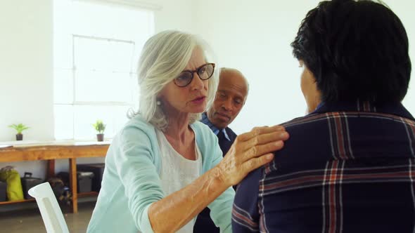 Senior therapist consoling a patient 4k