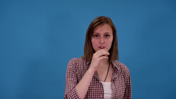 Girl Smokes a Stick Heater Tobacco