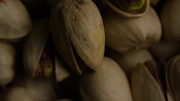 Cinematic, rotating shot of pistachios on a white surface - PISTACHIOS 033