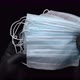 Anonymous paramedic hands showing lot medical face masks, holding equipment on black background - VideoHive Item for Sale
