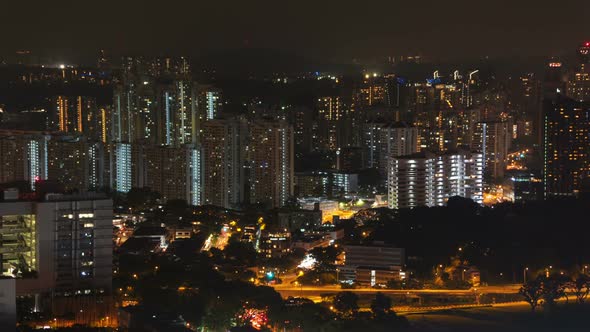 Buildings and Traffic in District at Night